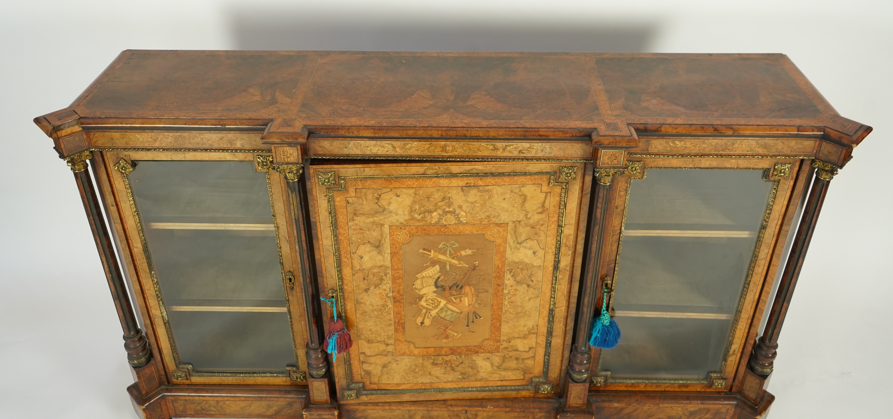 A Victorian birds eye maple banded, gilt metal mounted figured walnut side cabinet